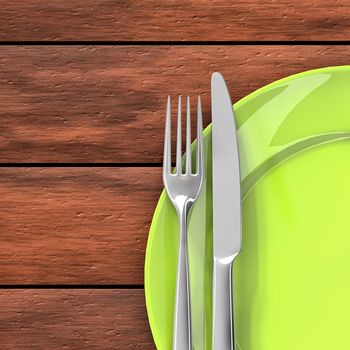 Knife, fork and green dish on the dining table