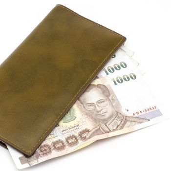 thai banknote in brown wallet isolated on white background