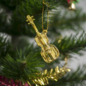 close up violin on christmas tree