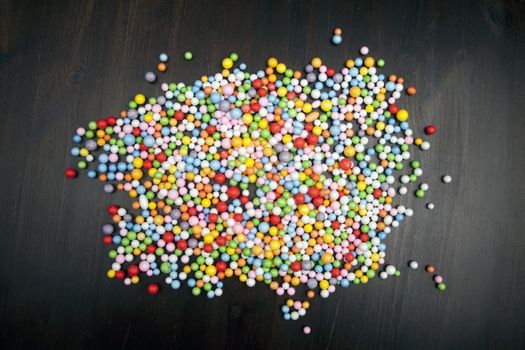 Color balls on wooden background