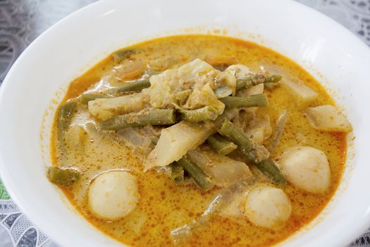 Lontong Sayur Lodeh Indonesian Gravy Dish with Cabbage String Beans and Fishballs Closeup