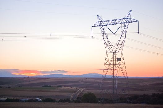 High voltage power line blue sky