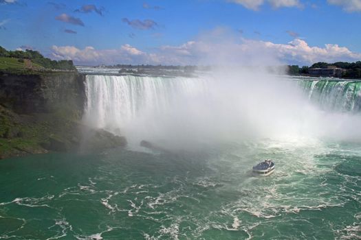 Niagara water fall and Maid of the Mist tourist boat.