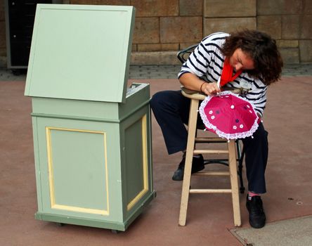 ORLANDO - OCT 24 :  An artist at the International Food and Wine Festival held in Disney's Epcot. The festival is held each year in the fall. Taken October 24, 2013 in Orlando, FL.