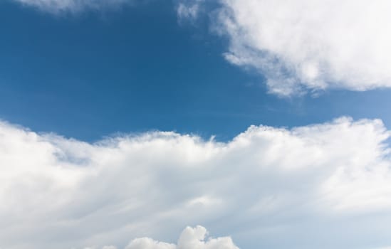 The white clouds background in blue sky