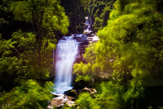 sirithan waterfall in inthanon national park chiangmai thailand with blur of tree effect