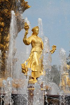 Girl with a fountain of friendship of peoples Ukraine