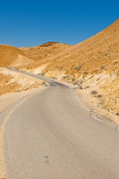 Winding Asphalt Road in the Negev Desert in Israel