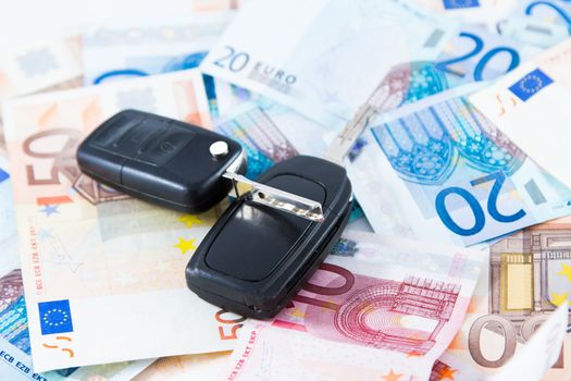 Car key on money background