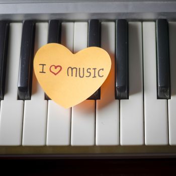 heart on key piano say love music