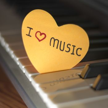 heart on key piano say love music