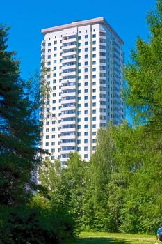 Beautiful view of modern apartment building under blue sky