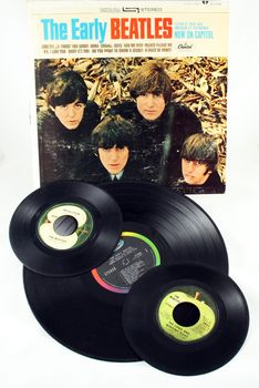 FRISCO, TX - February 8, 2014: Beatles LP and single vinyl records. The band marks its 50th anniversary appearance on the Ed Sullivan show Sunday, Feb. 9, 2014. They arrived on the American scene in 1964. McCartney and Ringo are the only two surviving members.
