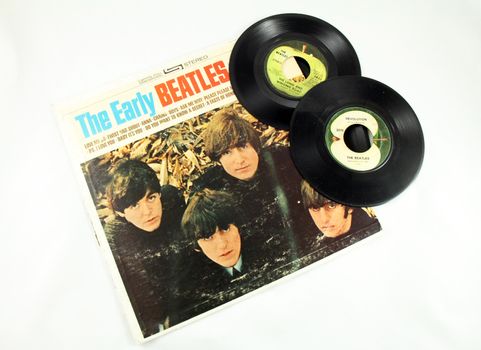 FRISCO, TX - February 8, 2014: Beatles LP and single vinyl records. The band marks its 50th anniversary appearance on the Ed Sullivan show Sunday, Feb. 9, 2014. They arrived on the American scene in 1964. McCartney and Ringo are the only two surviving members.