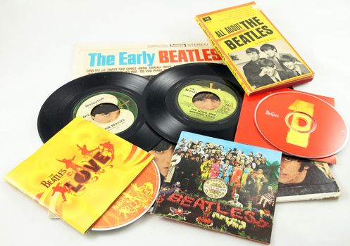 FRISCO, TX - February 8, 2014: Close-up of Beatles LP, singles, CDs and book. The band marks its 50th anniversary appearance on the Ed Sullivan show Sunday, Feb. 9, 2014. They arrived on the American scene in 1964. McCartney and Ringo are the only two surviving members.