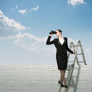 businesswoman climbed a ladder and looking through binoculars