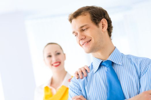 Businessman receiving congratulations from his colleagues in the leadership team work