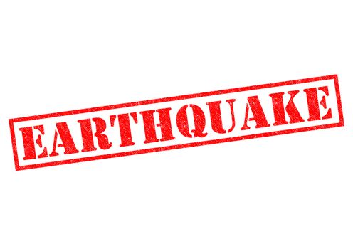 EARTHQUAKE red Rubber Stamp over a white background.