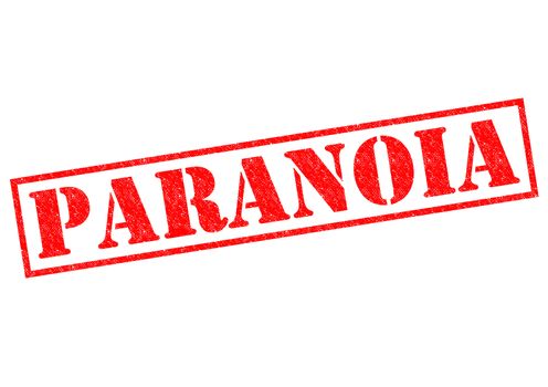 PARANOIA red Rubber Stamp over a white background.