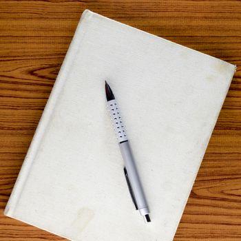 notebook on wood background