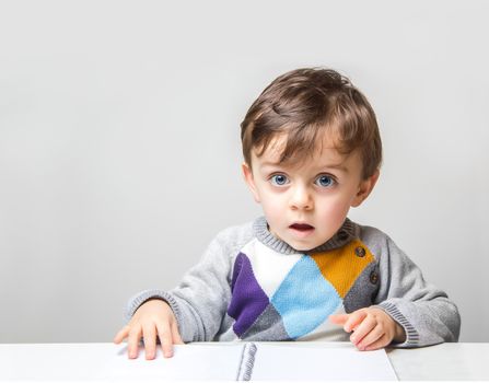 Child looking at the camera with an amazed look