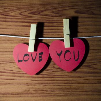 red heart word LOVE YOU on wood vintage stlye background