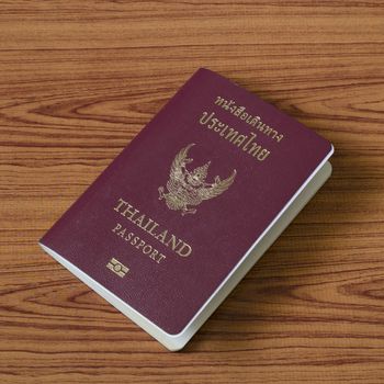 Thai passport on wood table background