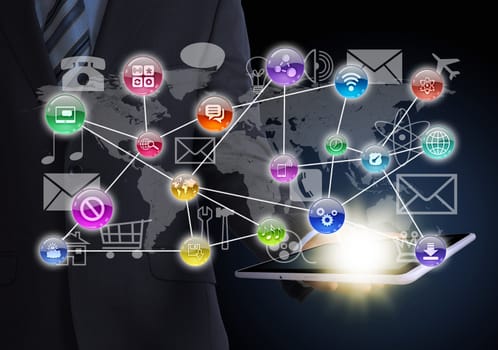 Man in suit holding tablet in hand. Application icons around tablet. The concept of software