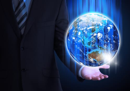 Man in suit holding a earth in hand. The concept of globalization