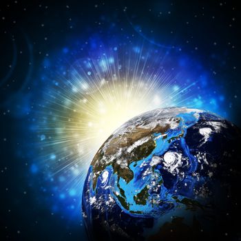 Earth planet in sun rays. Elements of this image are furnished by NASA
