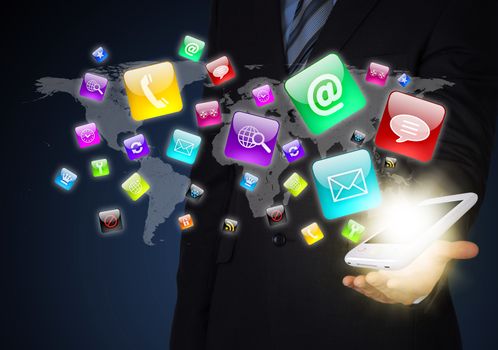 Man in suit holding a smartphone in hand. Application icons around smartphone. The concept of software