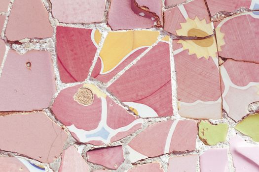 detailed  colorful mosaic ornament fragment from Park Guell, Barcelona, creation of Antonio Gaudi
