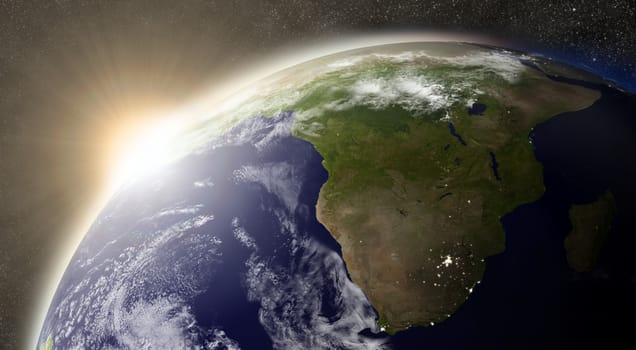 Sunset over South Africa region on planet Earth viewed from space with Sun and stars in the background. Elements of this image furnished by NASA.