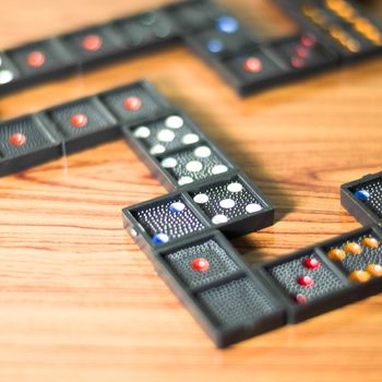 black domino on wooden background