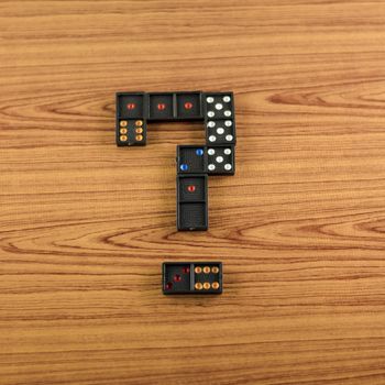 black domino on wooden background