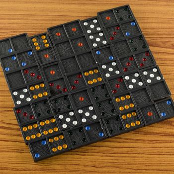 black domino on wooden background