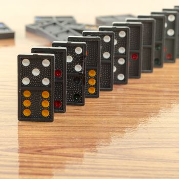 black domino on wooden background