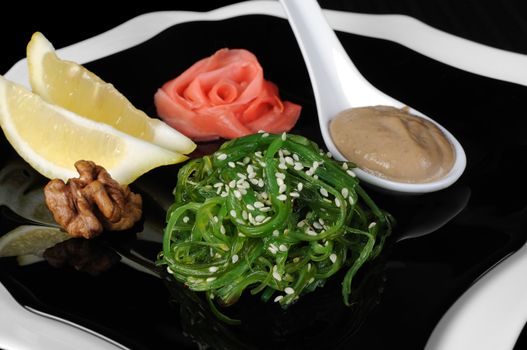 Chuka seaweed salad with peanut sauce, lemon and sesame seeds

