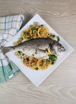 Baked Fish (Dorado) with lemon and olives