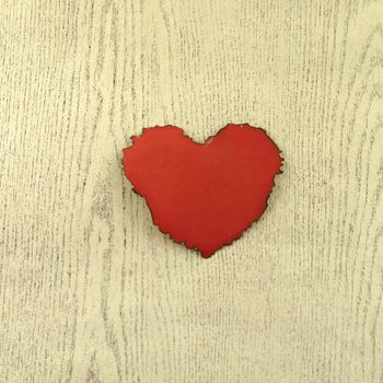 red heart on wood background