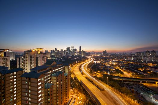 Ampang Kuala Lumpur Elevated Highway AKLEH with City Skyline in Malaysia at Twilight