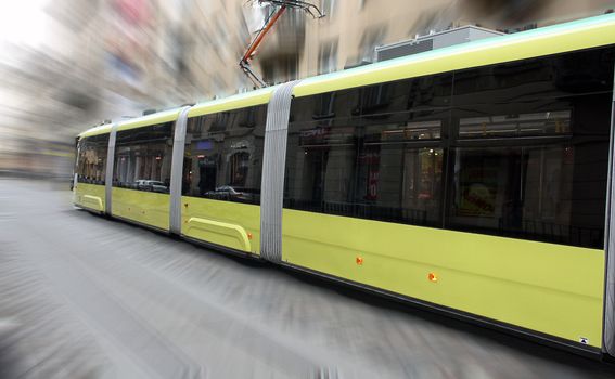 Shot of old tram speeding in the city street.