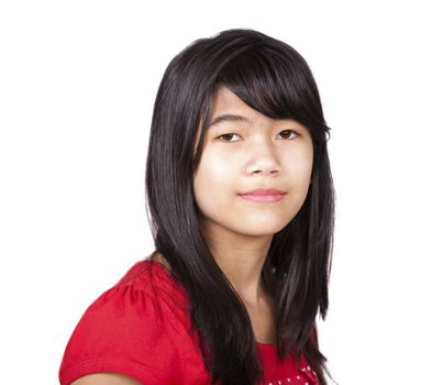 Preteen biracial girl in red shirt in studio