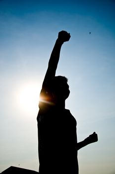 silhouette of man jumping for happy and hjappy