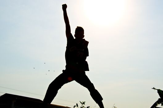 silhouette of man jumping for happy and hjappy