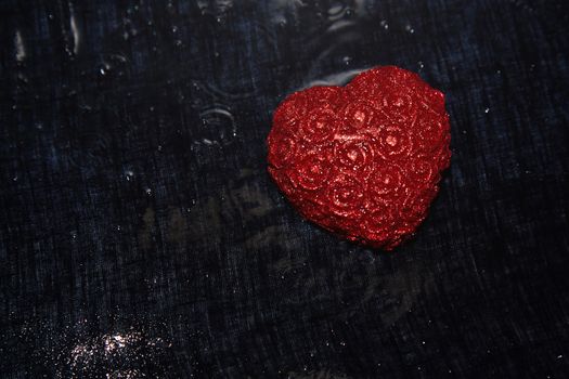 Heart shape in heavy rain. Close-up view