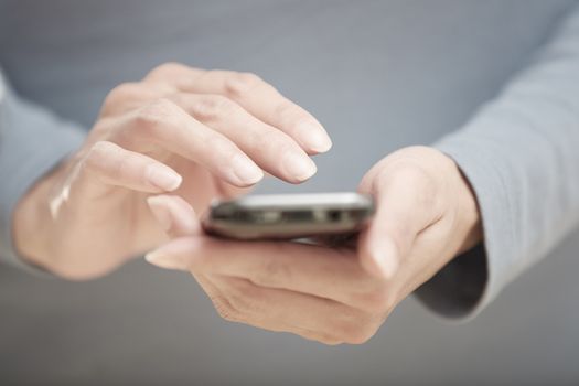 Human hands using smartphone with wi-fi Internet