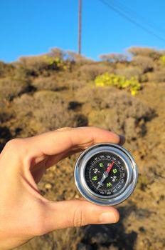 Orientation Concept Male Hand Holding a Metal Compass