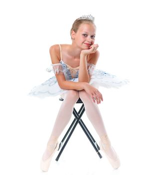 Beautiful young ballerina on a white background