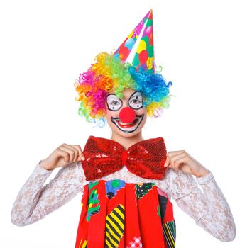 Portrait of a cute girl clown. Isolated on white background.